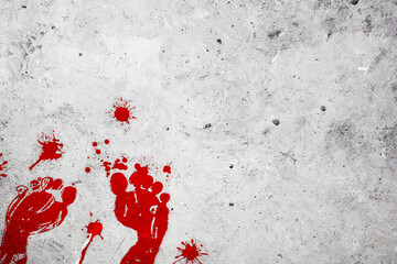 Bloody footprints with splashes of blood on concrete background