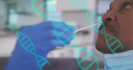 Animation of dna helix rotating over diverse doctor inserting cotton swab in senior man's neck - Powered by Adobe