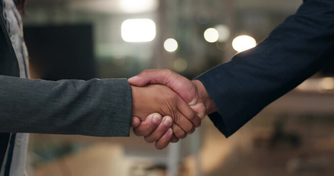 Closeup, night and business people with a handshake, cooperation and agreement for a b2b deal. Staff, teamwork and welcome with feedback, shaking hands and collaboration with partnership and support