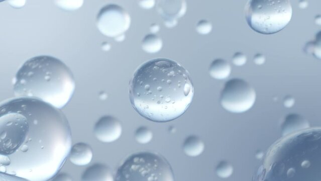 Numerous liquid bubbles in water rise up close-up on a light blue background. Extra-slow motion beautiful shiny blobs or drops of moisturizing bubble 3D animation design
