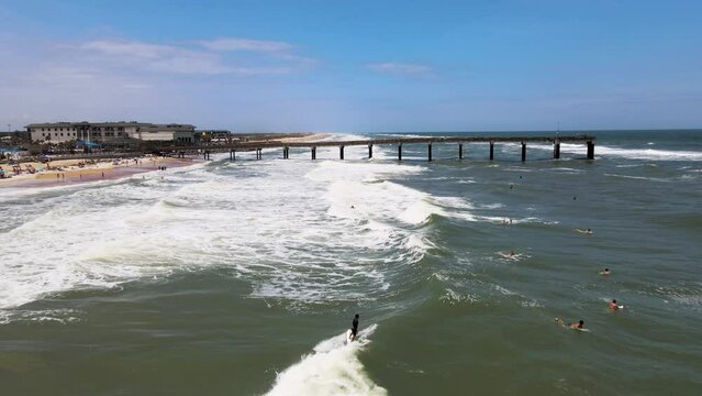 Aerial view of people doing surf at St. Augustine beach, Florida, United States.