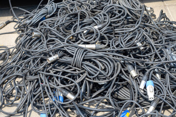 Wires from audio equipment. Tangled cables. Wires for concert equipment. Cable for lighting...