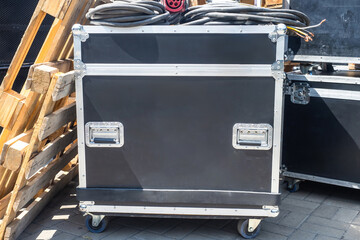 Suitcase on rings for musical equipment. Case with concert technique. Suitcase with equipment near...