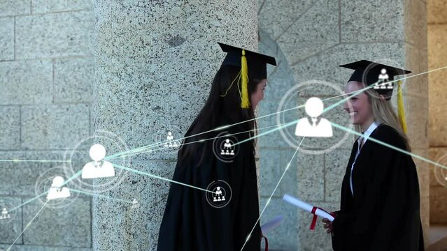 Animation of network of profiles over caucasian girls hugging celebrating after recieving a degree