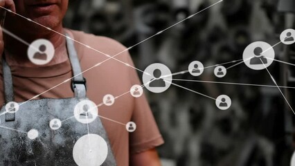Animation of network of profile icons over caucasian male worker talking on smartphone at a factory - Powered by Adobe