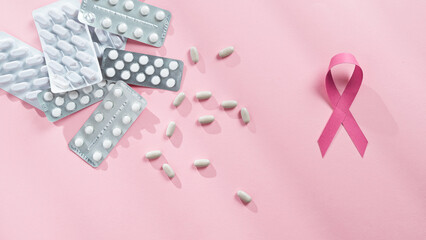 Pink Ribbon And Pills On Table
