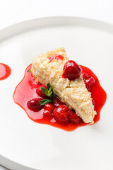 napoleon cake with cherry sauce and mint