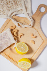 Cashew nut on cotton bag. Beige composition.