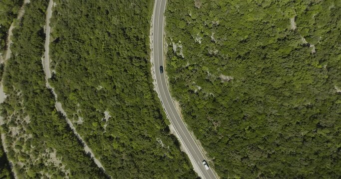 Aerial view of a road on the hills following the Limski Fjord (Canal di Leme) in Sveti Lovrec, Istria, Croatia.