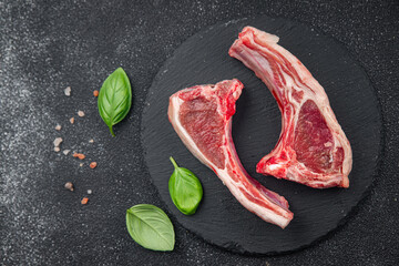 raw lamb cutlet meat on the bone slice meal food snack on the table copy space food background rustic top view 