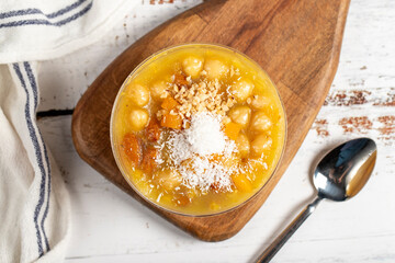 Ashura dessert on a white background. Delicious noah pudding in bowl. local name asure