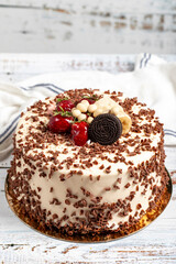 Cake with whipped cream and fruit. Birthday cake on white background