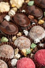 Truffle chocolate. Various chocolate pralines in bulk. close up