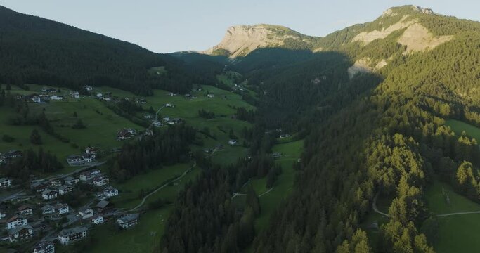 Aerial view of Dobbiaco town as seen from Croda dei Baranci (Birkenkofel) mountain peak on the Dolomites range, Trentino, South Tyrol, Italy.