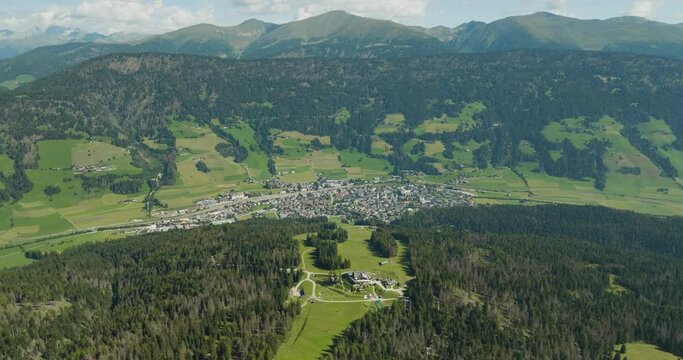 Aerial view of San Candido town as seen from Croda dei Baranci (Birkenkofel) mountain peak on the Dolomites range, Innichen, Trentino, South Tyrol, Italy.