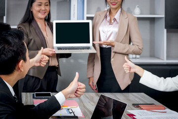 Businesspeople discussing at conference office desk, business team giving thumbs up to admire...