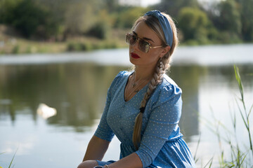 Portrait of a girl on the river bank