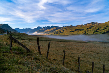 Beautiful valley with green mountains and blue sky in the early morning