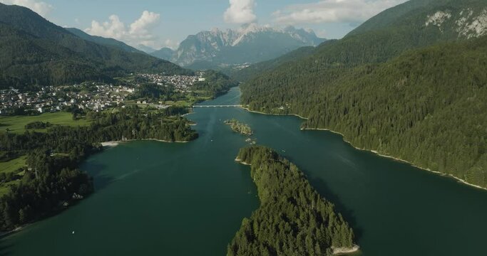 Aerial view of Caprioli Island (Isola dei Caprioli) on Cadore Lake (Lago di Cadore) on the Dolomites Mountains, Belluno, Veneto, Italy.