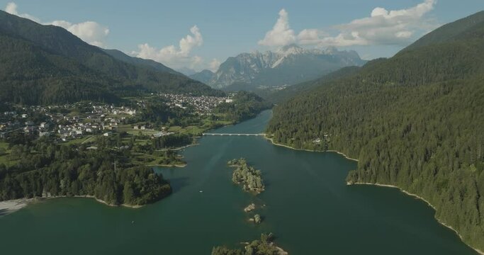 Aerial view of Caprioli Island (Isola dei Caprioli) on Cadore Lake (Lago di Cadore) on the Dolomites Mountains, Belluno, Veneto, Italy.