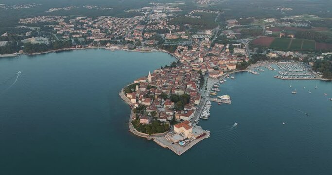 Aerial view of Porec at sunset, a small town along the Adriatic Sea coastline in Istria, Croatia.