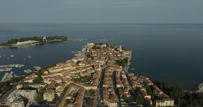Aerial view of Porec at sunset, a small town along the Adriatic Sea coastline in Istria, Croatia.