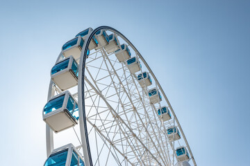 Ferris wheel against blue sky. Attraction in Helsinki, Finland.
