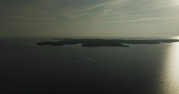 Aerial view of Brijuni National Park, a group of islands along the Adriatic Sea coastline at sunset near Pula, Istria, Croatia.
