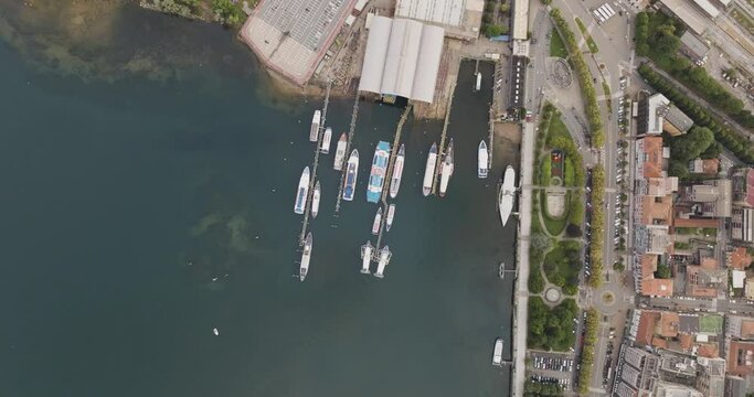 Aerial view of a shipyard in Arona, a small town along the Lago Maggiore (Lake Maggiore) at sunset, Novara, Piedmont, Italy.