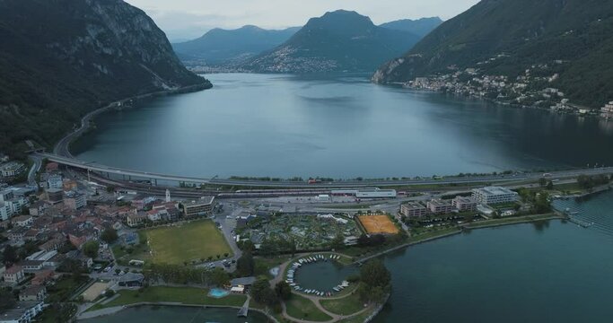 Aerial view of Melide, a small town along the Lugano Lake at sunset in Ticino, Switzerland.