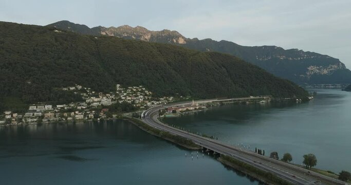 Aerial view of Melide, a small town along the Lugano Lake at sunset in Ticino, Switzerland.