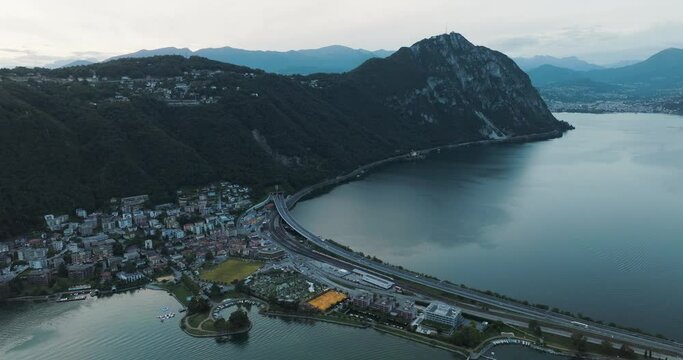 Aerial view of Melide, a small town along the Lugano Lake at sunset in Ticino, Switzerland.