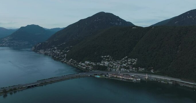 Aerial view of Melide, a small town along the Lugano Lake at sunset in Ticino, Switzerland.