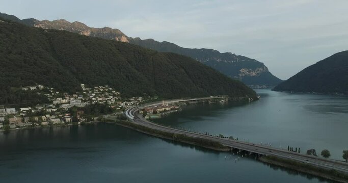 Aerial view of Melide, a small town along the Lugano Lake at sunset in Ticino, Switzerland.