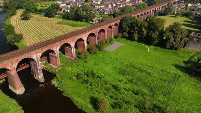 Aerial video of Whalley Viaduct, also known as Whalley Arches. Build between 1836 to 1850 the 605 meters long bridge is a magnificent superstructure. 