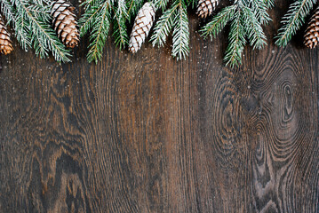 Natural christmas background, fir branches with snow on the dark brown wooden table - 644512761