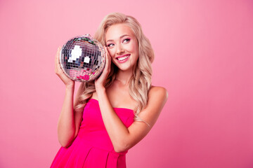 Photo of charming tricky girl dressed sexy outfit rising disco ball looking empty space isolated...