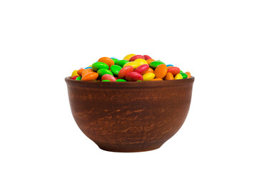 Multicolored candies in a bowl on a colored background. birthday and holiday concept. Top view with copy space