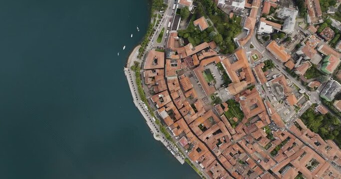 Aerial view of Arona, a small town along the Lago Maggiore (Lake Maggiore) at sunset, Novara, Piedmont, Italy.