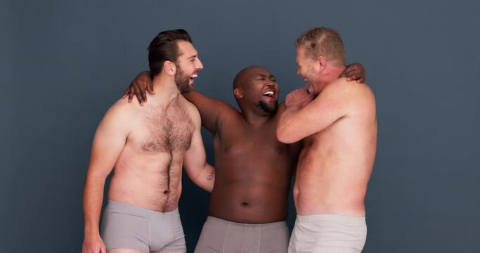 Men, body positivity and happy hug with diversity, confidence and happy in studio and underwear. Portrait, male group and grey background with friends, smile and pride with solidarity and model