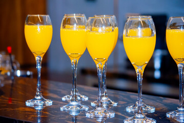 Alcoholic drink made with orange juice and champagne called Mimosa, a space for celebration and joy. - 644532536