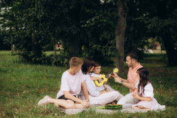 Photo of full big family five people three little kids sit bench table relax delicious dinner eat sandwich apples salad generation sunny weekend comfort home park backyard outdoors