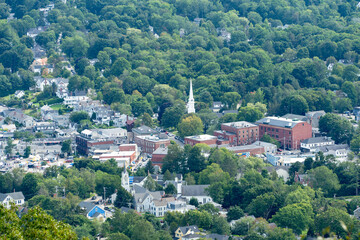 Fototapeta na wymiar The town of Camden Maine from the top of a mountain on a humid summer day