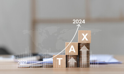 Interest Rates, Inflation and Taxes Place the wooden block on the coin with the Tax 2024 icon with...
