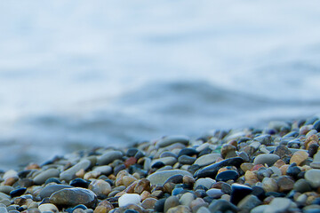 Abstract nature pebbles background. Texture of blue pebbles. Stone background. Sea pebble beach. Beautiful nature