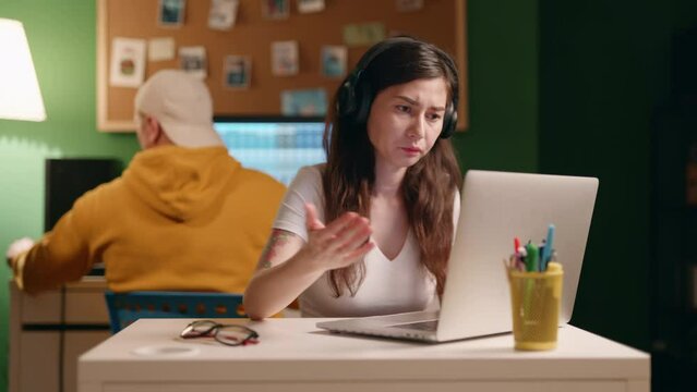 Tired overworked workaholic Asian female employee tries to fix problem using laptop working on deadline task, urgent project feels exhausted. Over hours job, hard-working concept. SOmething goes wrong