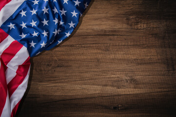 Obraz premium Top view overhead America United States flag, memorial remembrance and thank you of hero, studio shot with copy space on wooden table background, USA holiday Veterans or Independence day concept.