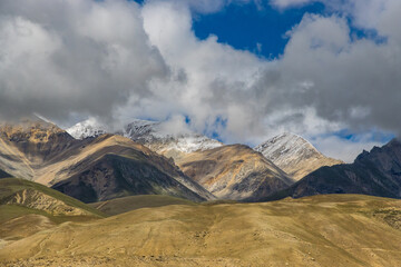 Fototapeta na wymiar Dark Clouds HImalayan Mountains and Road to Korala Border between Tibet China and Upper Mustang, Nepal