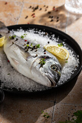 Raw fish on a sea salt before cooking