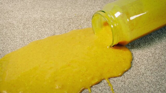 Jar Of Curry Sauce Drops On Carpet